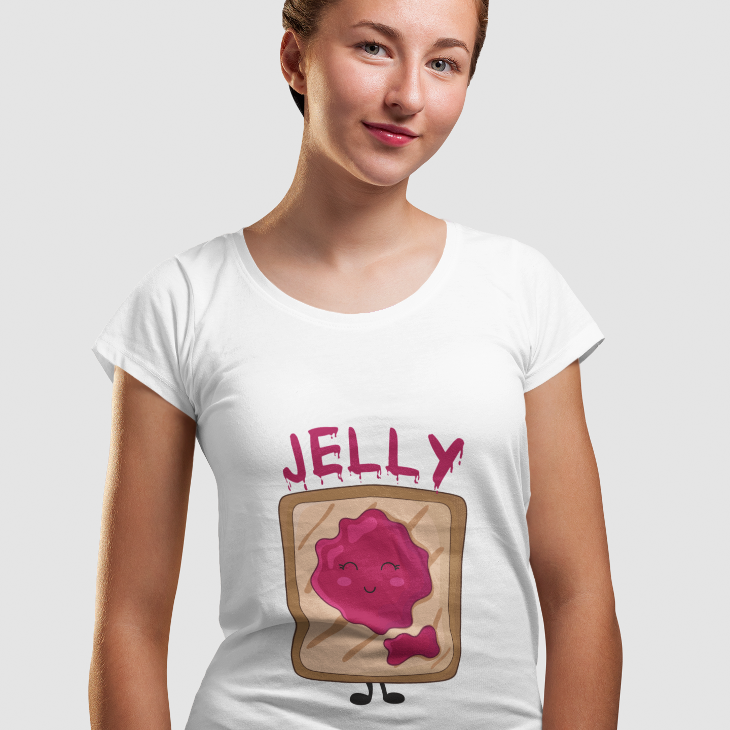 Person wearing a white t-shirt with a pink jelly design on a light gray background