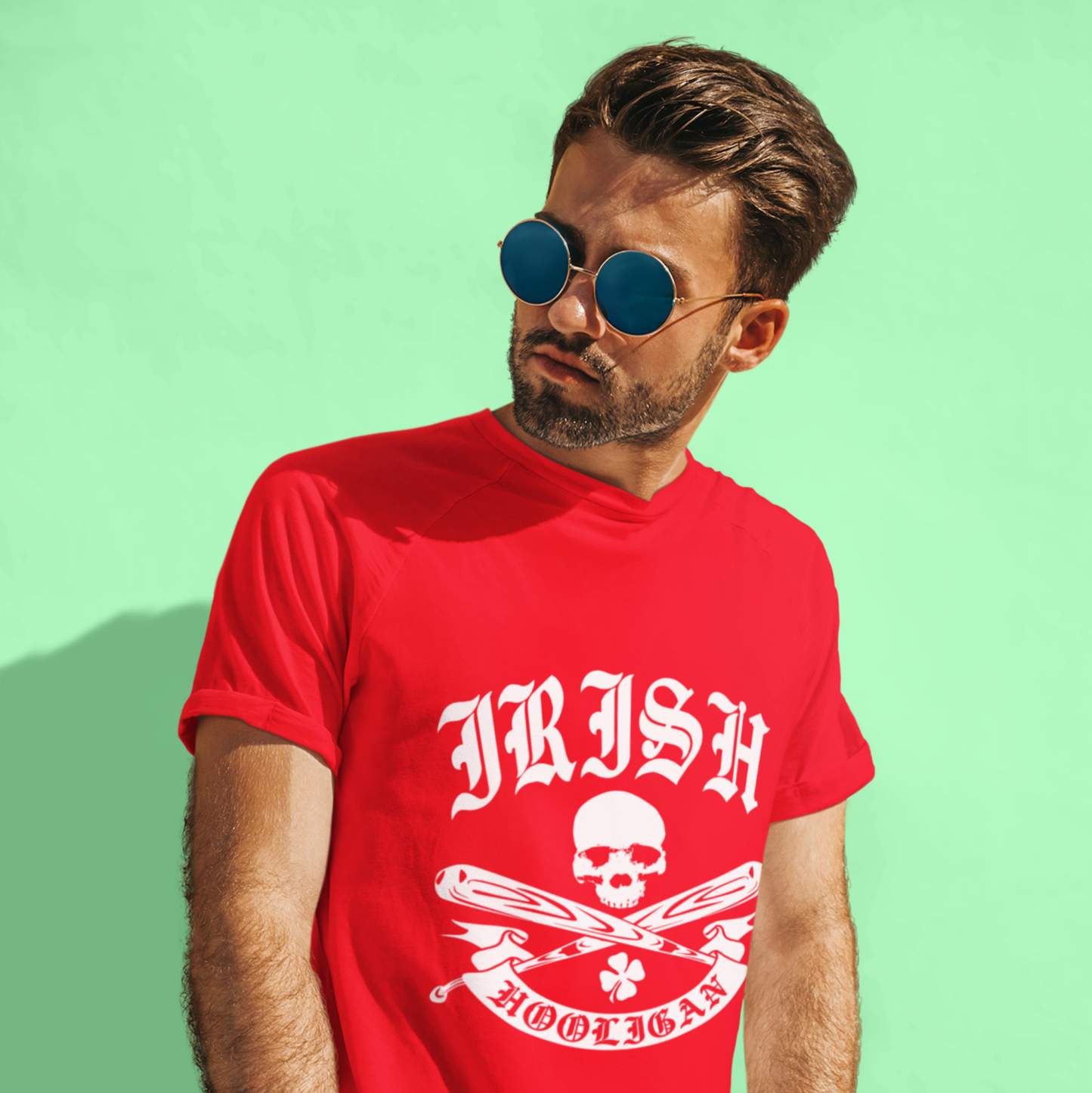 Man wearing a red t-shirt with 'Irish Hooligan' design on a green background