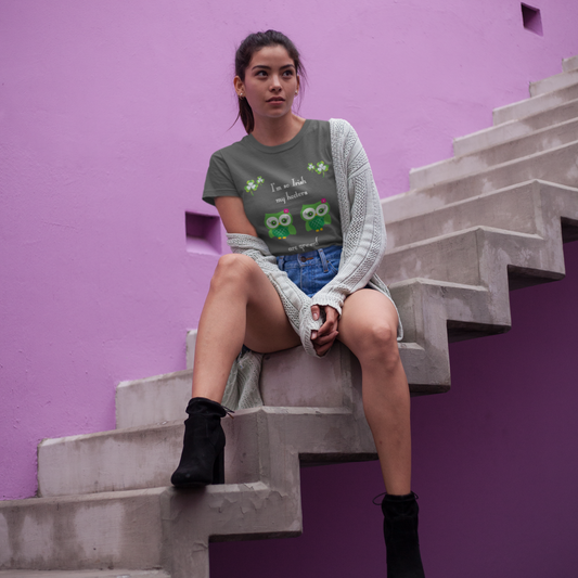 Woman sitting on concrete steps against a purple wall