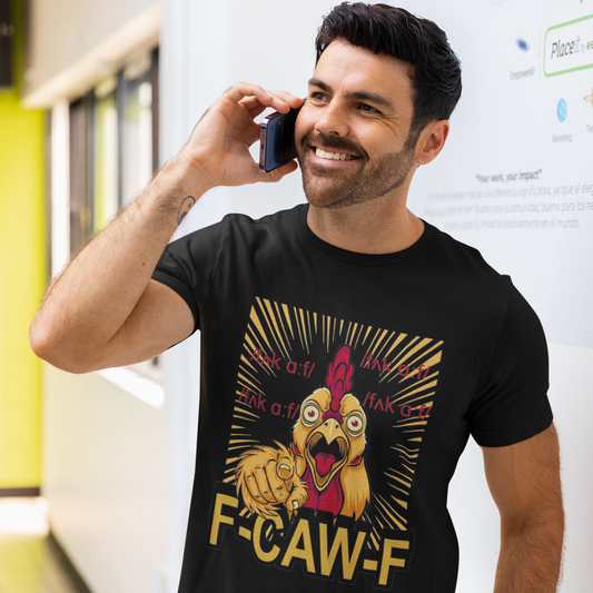 Man wearing a black t-shirt with a graphic design and text, talking on a phone in an indoor setting.