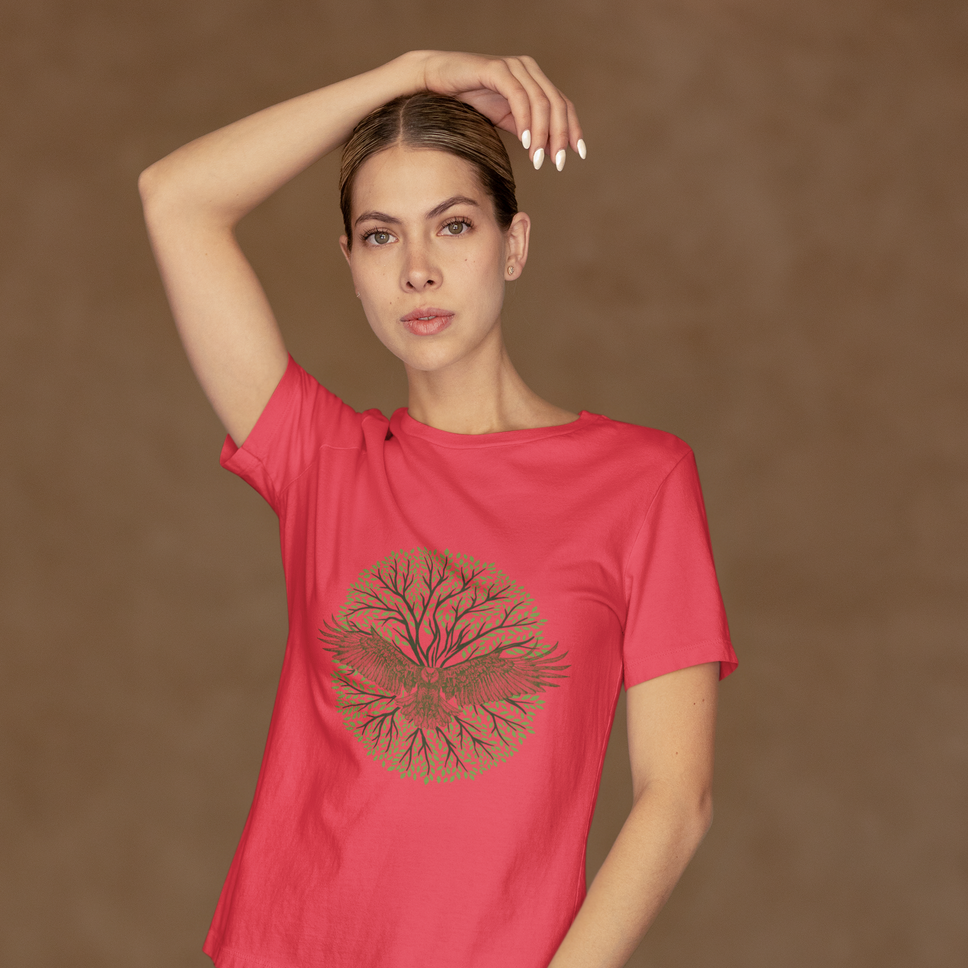 Woman wearing a red t-shirt with a graphic design on a brown background