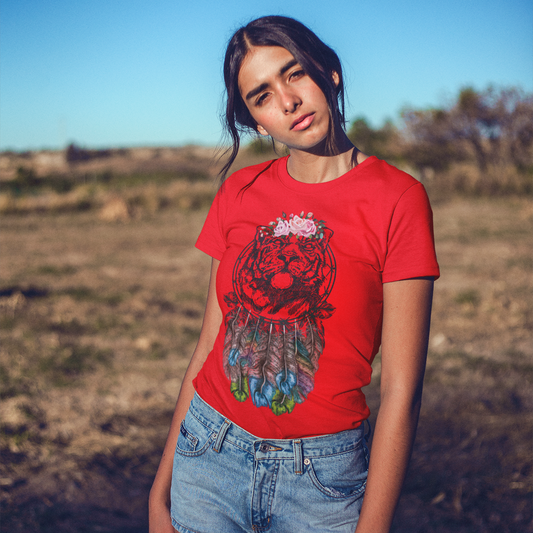 Person wearing a red t-shirt with a graphic design outdoors