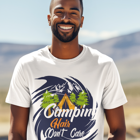Man wearing a white t-shirt with a camping-themed design outdoors.