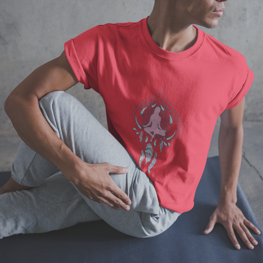 Person wearing a red t-shirt with a graphic design sitting on a yoga mat.