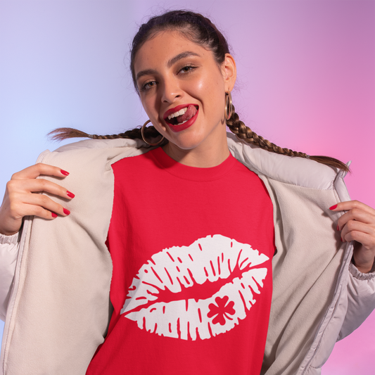 Woman wearing a red t-shirt with a white lip print design on a gradient background