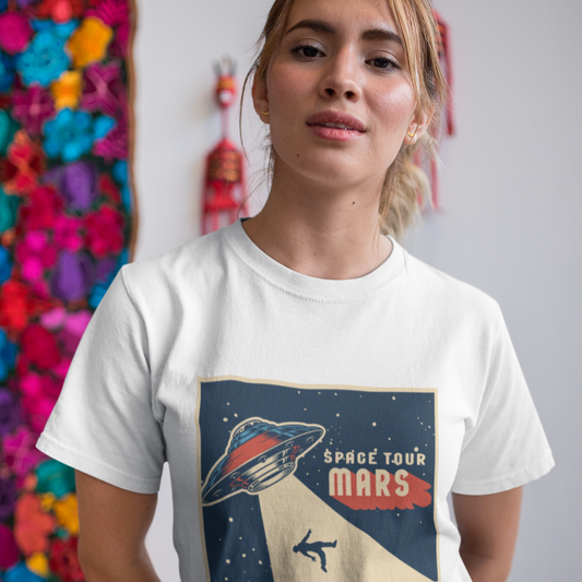 Person wearing a white t-shirt with a space-themed design, standing in front of colorful decorations.