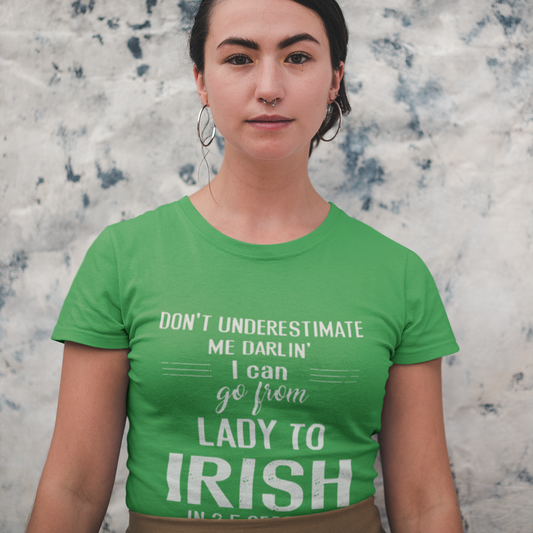 Person wearing a green t-shirt with text against a textured wall background