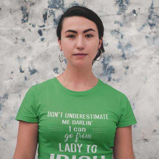 Person wearing a green t-shirt with text against a textured wall background