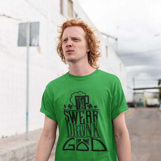 Person wearing a green t-shirt with text outdoors