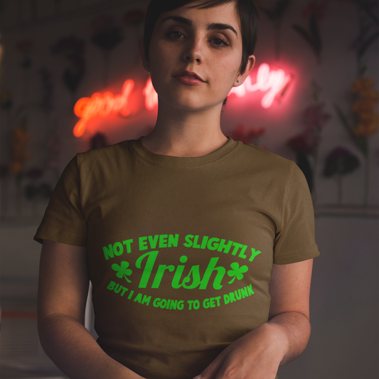 Person wearing a brown t-shirt with green text in a dimly lit room with neon lights.