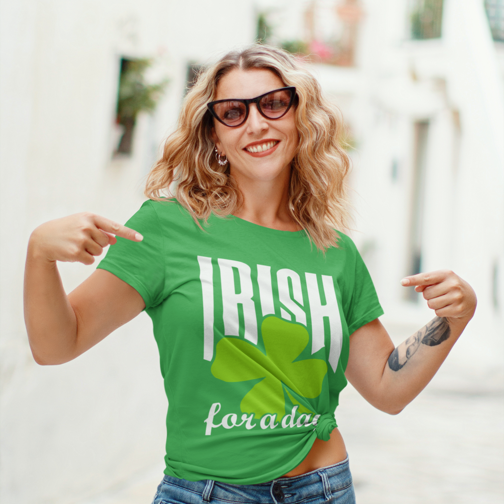 Woman wearing a green 'Irish for a day' t-shirt outdoors.