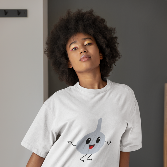 Person wearing a white t-shirt with a cartoon character design, standing indoors.