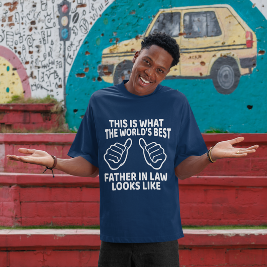 Person wearing a blue t-shirt with text and graphics, standing in front of a colorful mural.