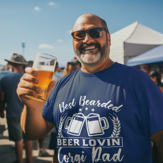 Man holding a beer at an outdoor event wearing a blue t-shirt with text.