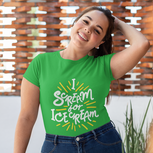 Woman wearing a green t-shirt with 'I scream for ice cream' text, standing outdoors.