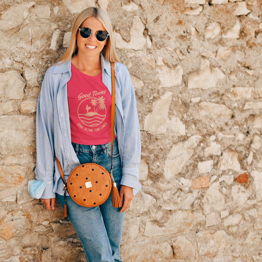 Woman in casual outfit standing against a stone wall