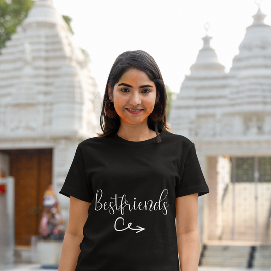 Woman wearing a black t-shirt with 'Bestfriends' text in front of a temple.