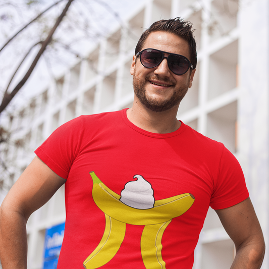 Man wearing a red t-shirt with a banana ice cream design, standing outdoors.