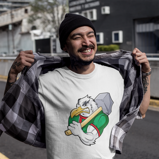 Man wearing a white t-shirt with a cartoon character design, holding a plaid shirt.