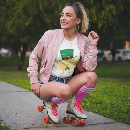 Woman in pink jacket and roller skates posing outdoors on a sidewalk.