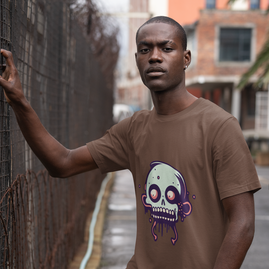 Man wearing a brown t-shirt with a graphic design, standing outdoors.