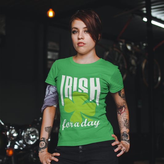 Person wearing a green 'Irish for a day' t-shirt in a dimly lit setting.