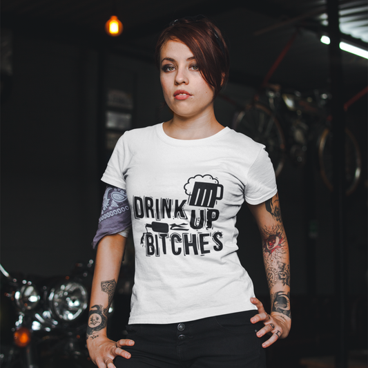 Person wearing a white t-shirt with a graphic design and text, standing in a dark setting.