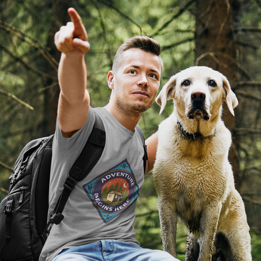 Man with a dog sitting on a log in a forest, pointing forward.
