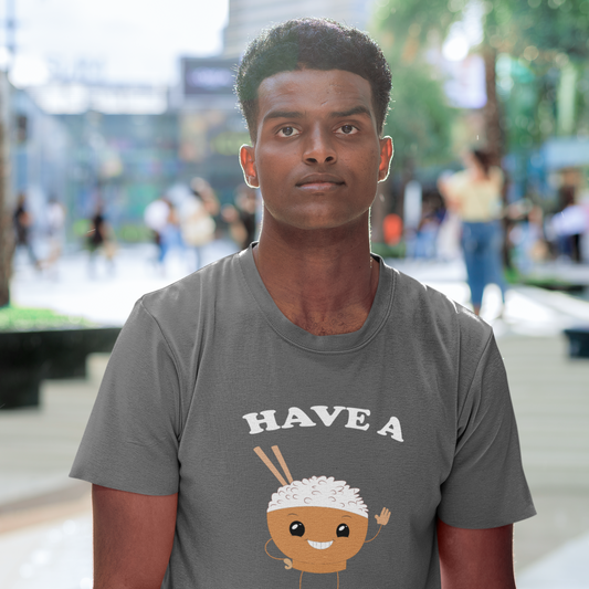 Man wearing a gray t-shirt with a cartoon character and text in an urban setting