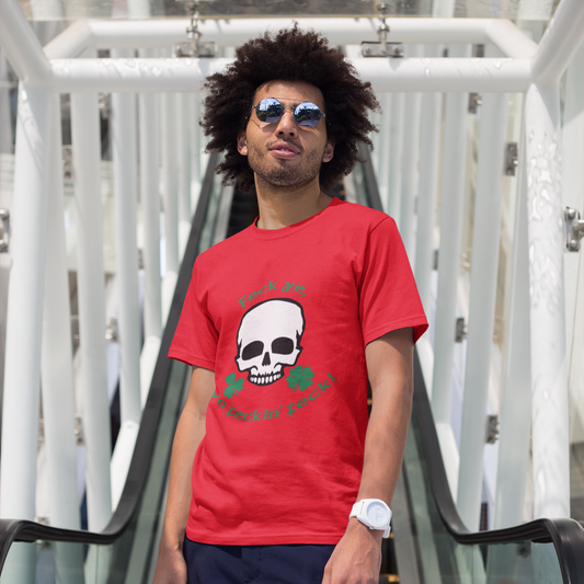 Man wearing a red t-shirt with a skull design on an outdoor staircase.