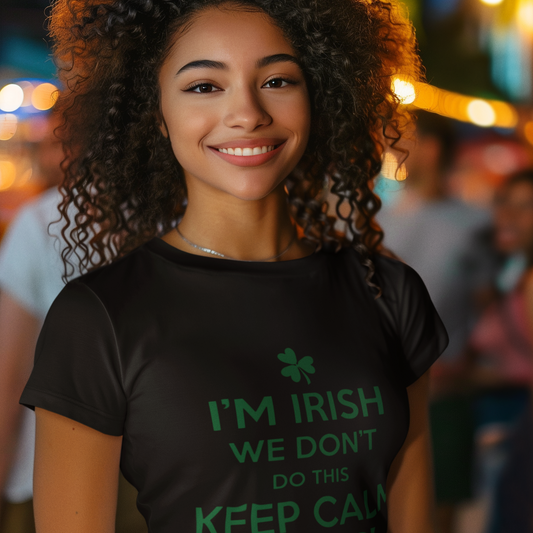 Person wearing a black t-shirt with green text in a festive outdoor setting