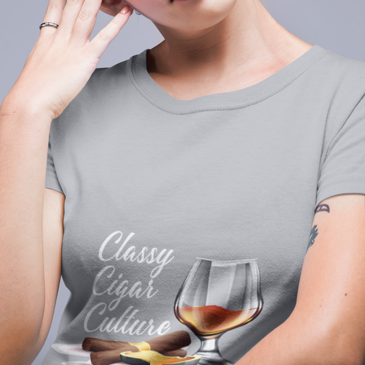 Person wearing a gray t-shirt with a graphic of a glass of whiskey and text.
