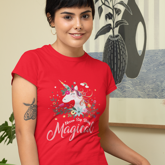 Person wearing a red t-shirt with a unicorn design and text, standing indoors.