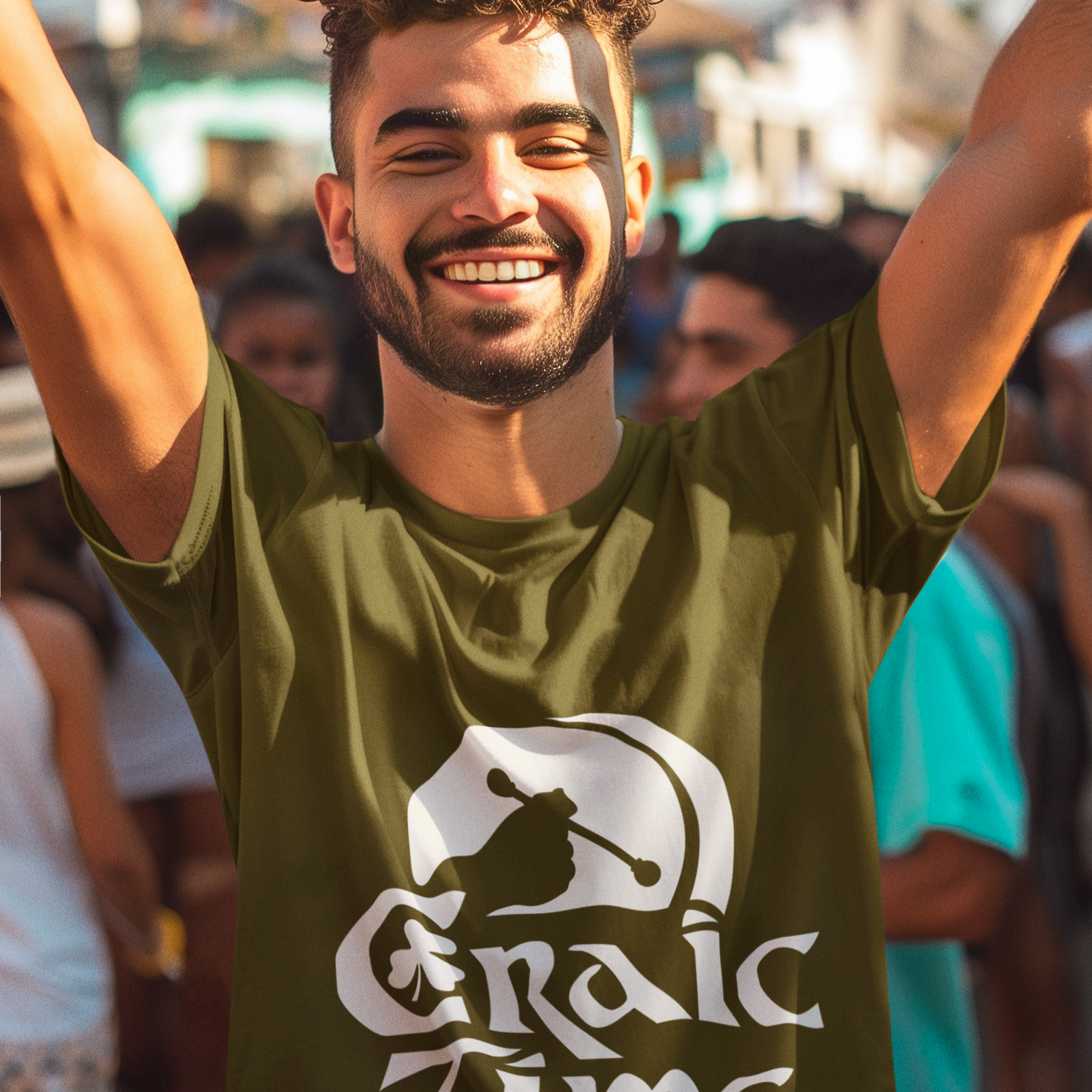 Man wearing a green 'Graic Time' t-shirt with arms raised in an outdoor setting