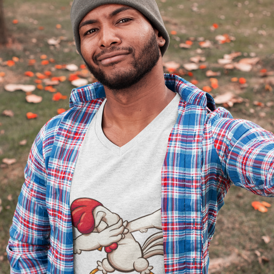Man wearing a plaid shirt over a graphic t-shirt with a cartoon character, standing outdoors.