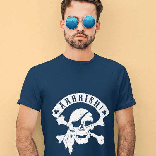 Man wearing a navy blue t-shirt with a skull and crossbones design and 'ARRRISH!' text on a beige background.