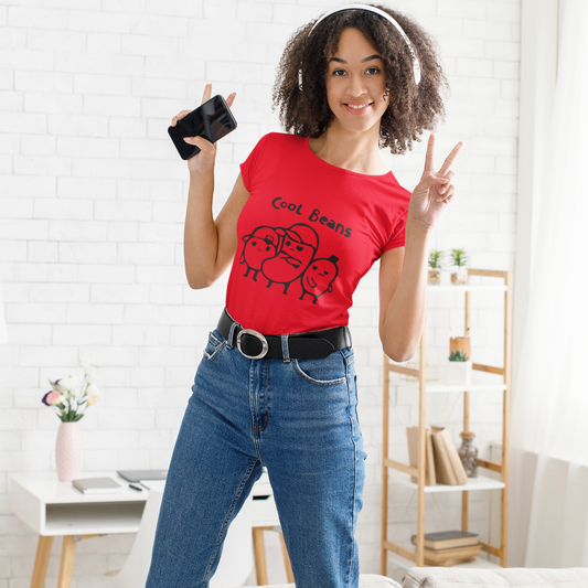 Woman in a red t-shirt and blue jeans standing in a living room.