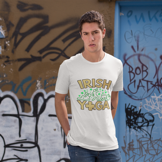 Man wearing an 'Irish Yoga' t-shirt standing in front of a graffiti-covered wall.