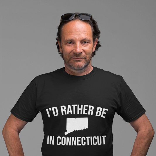 Man wearing a black t-shirt with 'I'd Rather Be In Connecticut' text and graphic on a gray background