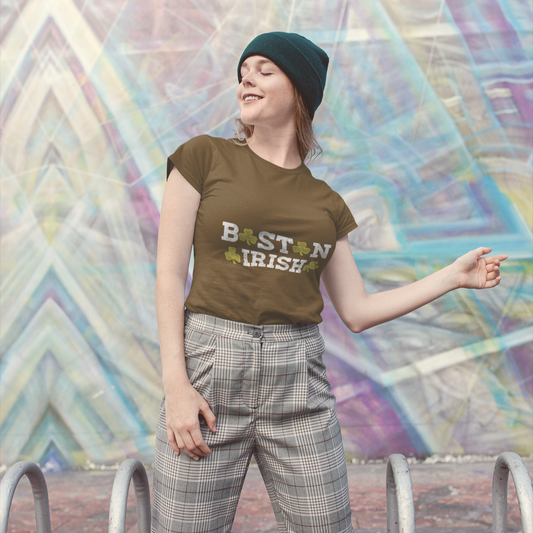 Person wearing a 'Boston Irish' t-shirt in front of a colorful geometric mural.