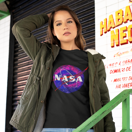 Woman wearing a black t-shirt with NASA logo outdoors