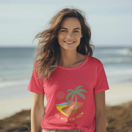 Woman wearing a pink t-shirt with a palm tree design on a beach