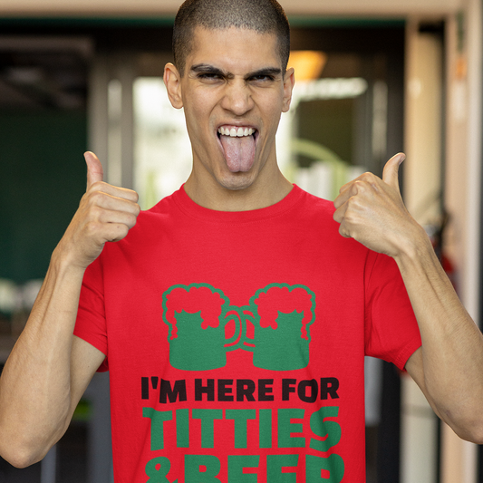 Man wearing a red t-shirt with green text and graphics, giving a thumbs-up gesture.