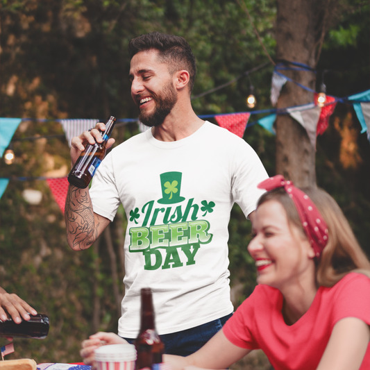 Man wearing a 'Irish Beer Day' t-shirt at a outdoor gathering with a woman.