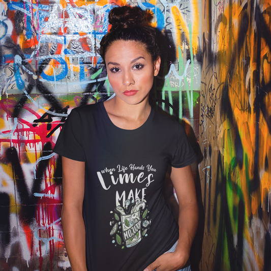 Woman wearing a black t-shirt with text and graphics against a colorful graffiti wall.