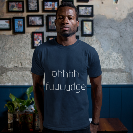 Man wearing a navy blue t-shirt with text in a casual setting